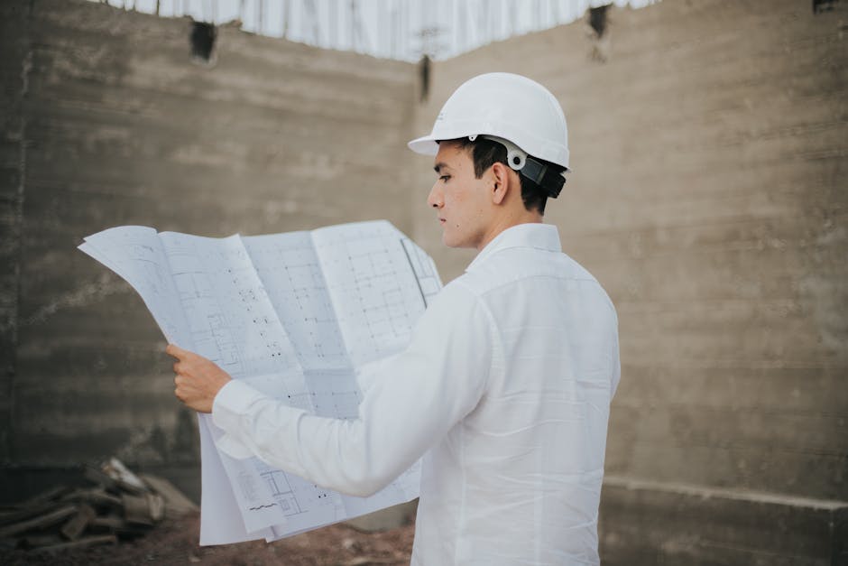 Contractor reviewing kitchen blueprints